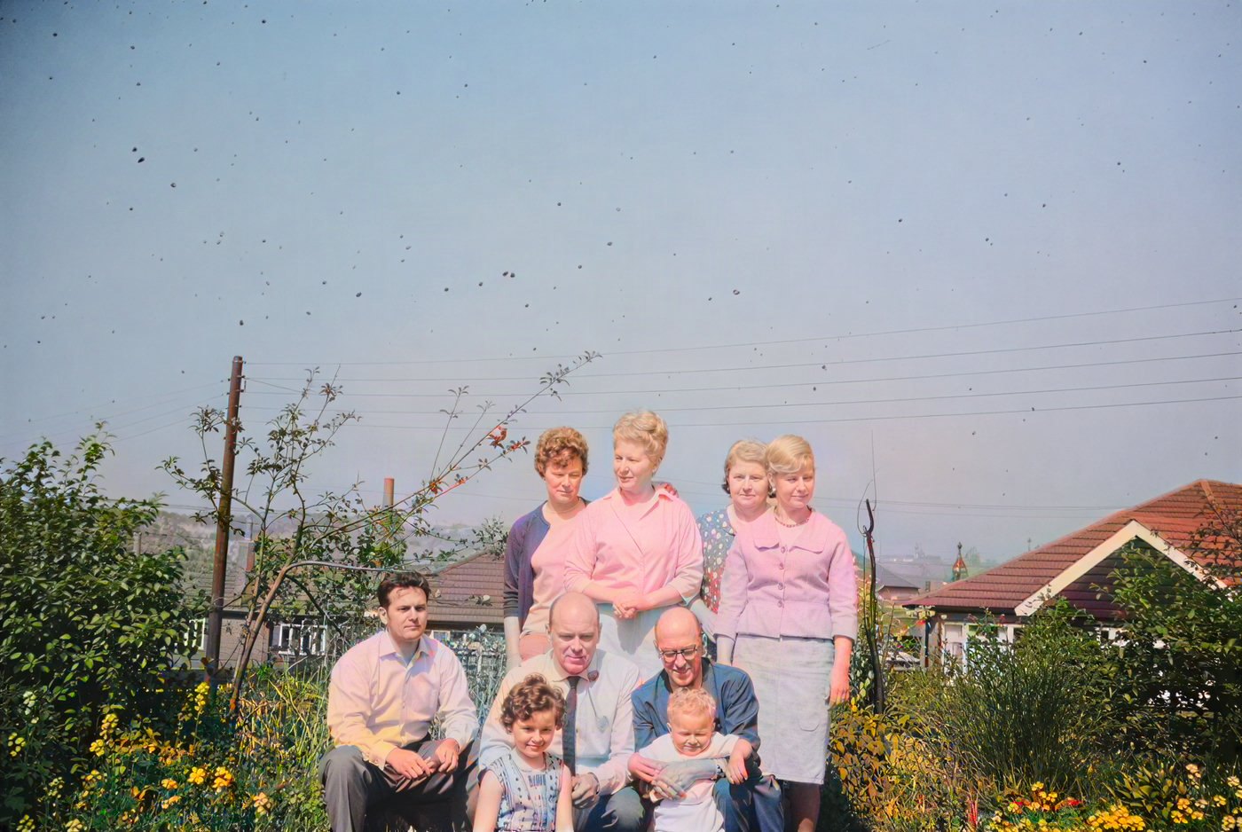 The same 1960s family group after AI colorization