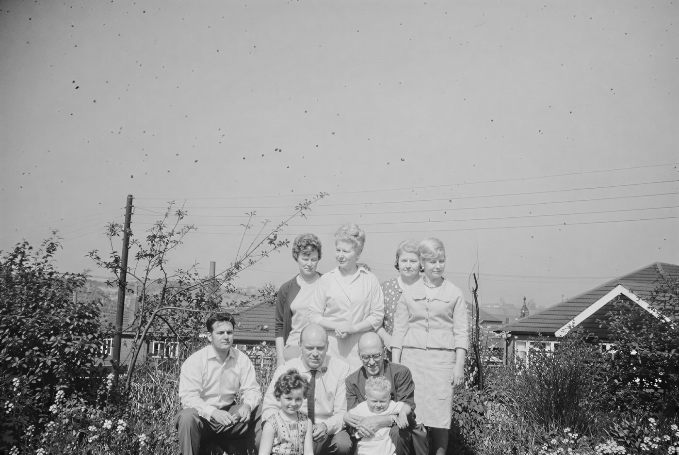 1960s family group in black and white, before AI colorization